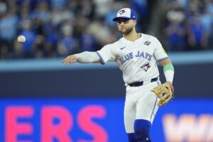 Blue Jays designated hitter Bo Bichette throws the ball.