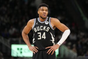 Bucks forward Giannis Antetokounmpo puts his hands on his hip.