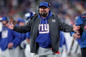 Giants head coach Brian Daboll puts his arms out.