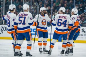 Islanders forward Anthony Duclair celebrates with players.