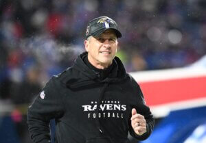 John Harbaugh takes the field.