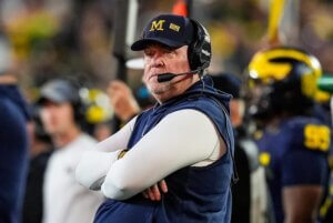 Michigan defensive coordinator Wink Martindale stands on sidelines.