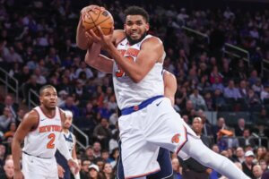 Karl-Anthony Towns holds the ball in his hands.