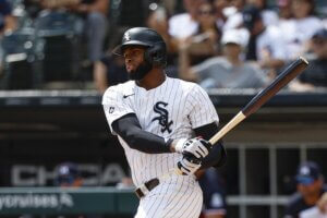 White Sox center fielder Luis Robert Jr. swings a bat.