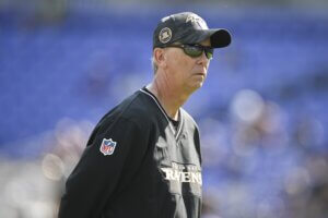 Ravens offensive coordinator Todd Monken stands on the sidelines.