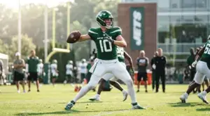 Jets quarterback practicing throws during OTA session on outdoor field