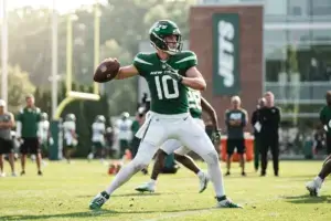 Jets quarterback practicing throws during OTA session on outdoor field