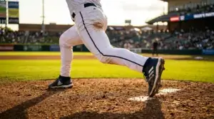 Baseball pitcher's leg planted on mound during delivery, emphasizing strength and foundation