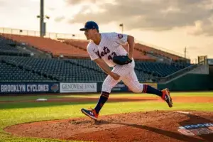 Mets pitcher Kodai Senga delivering a pitch during minor league rehab assignment