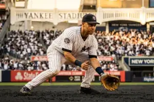 Yankees shortstop in defensive stance at Yankee Stadium during game