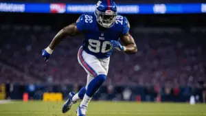 Giants linebacker explosively rushing through the line during NFL game at MetLife Stadium