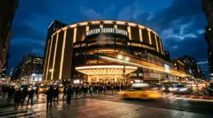 Madison Square Garden exterior at dusk with dramatic lighting and New York City atmosphere