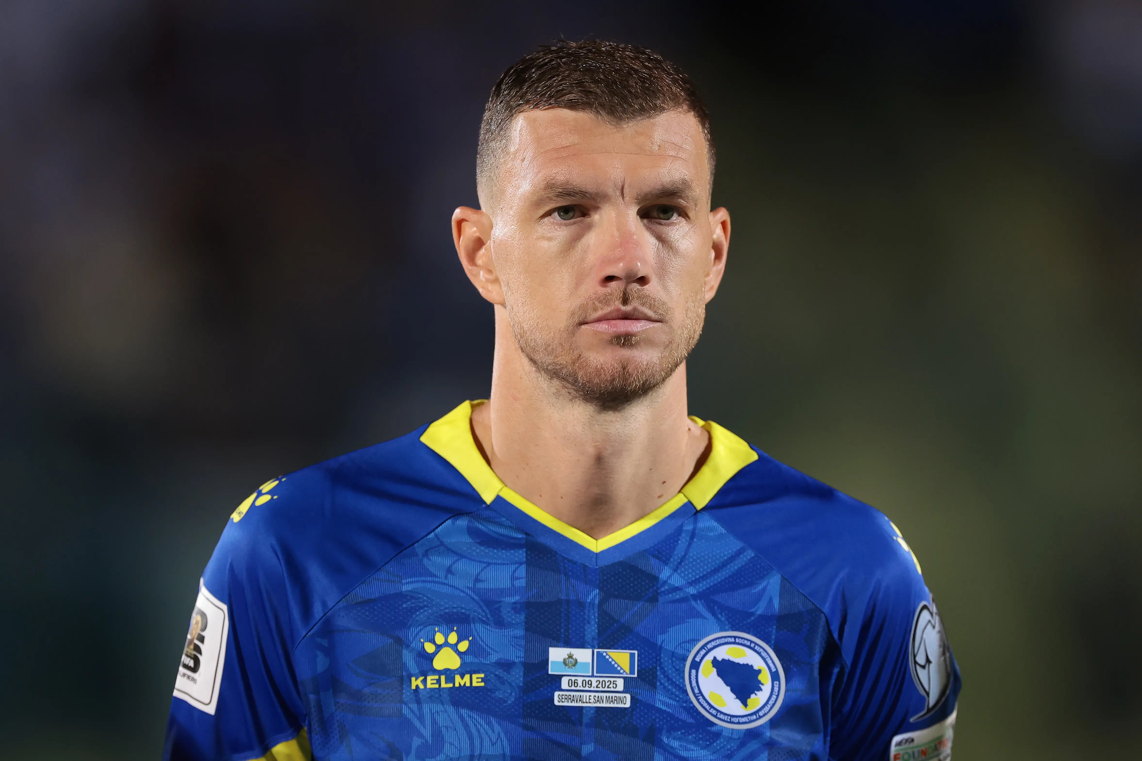Edin Dzeko wearing the Bosnia national team jersey during a match.