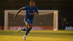 Kylian Mbappé sprinting in French national team jersey during World Cup 2026 match action