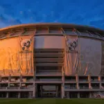 MetLife Stadium exterior with World Cup 2026 banners at sunset in East Rutherford, New Jersey