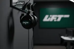 NFL coaching headset hanging in team facility office with dramatic lighting
