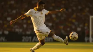 Ecuador soccer player shooting on target during World Cup 2026 match at packed stadium