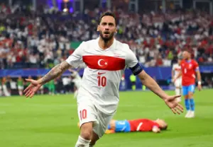 Turkey national football team posing for a group photo in red uniforms.