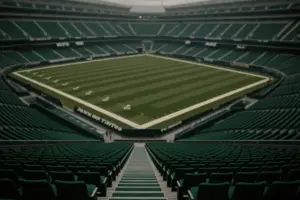 Empty Jets stadium seats with distant field view representing organizational uncertainty and future focus