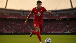 Jonathan David in Canada jersey attacking during World Cup match at BC Place Vancouver