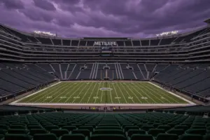 Empty MetLife Stadium at dusk with storm clouds symbolizing Jets playoff drought