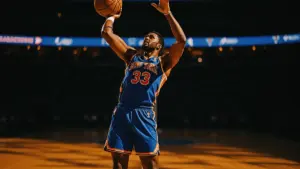 New York Knicks player shooting three-pointer at Madison Square Garden in game action