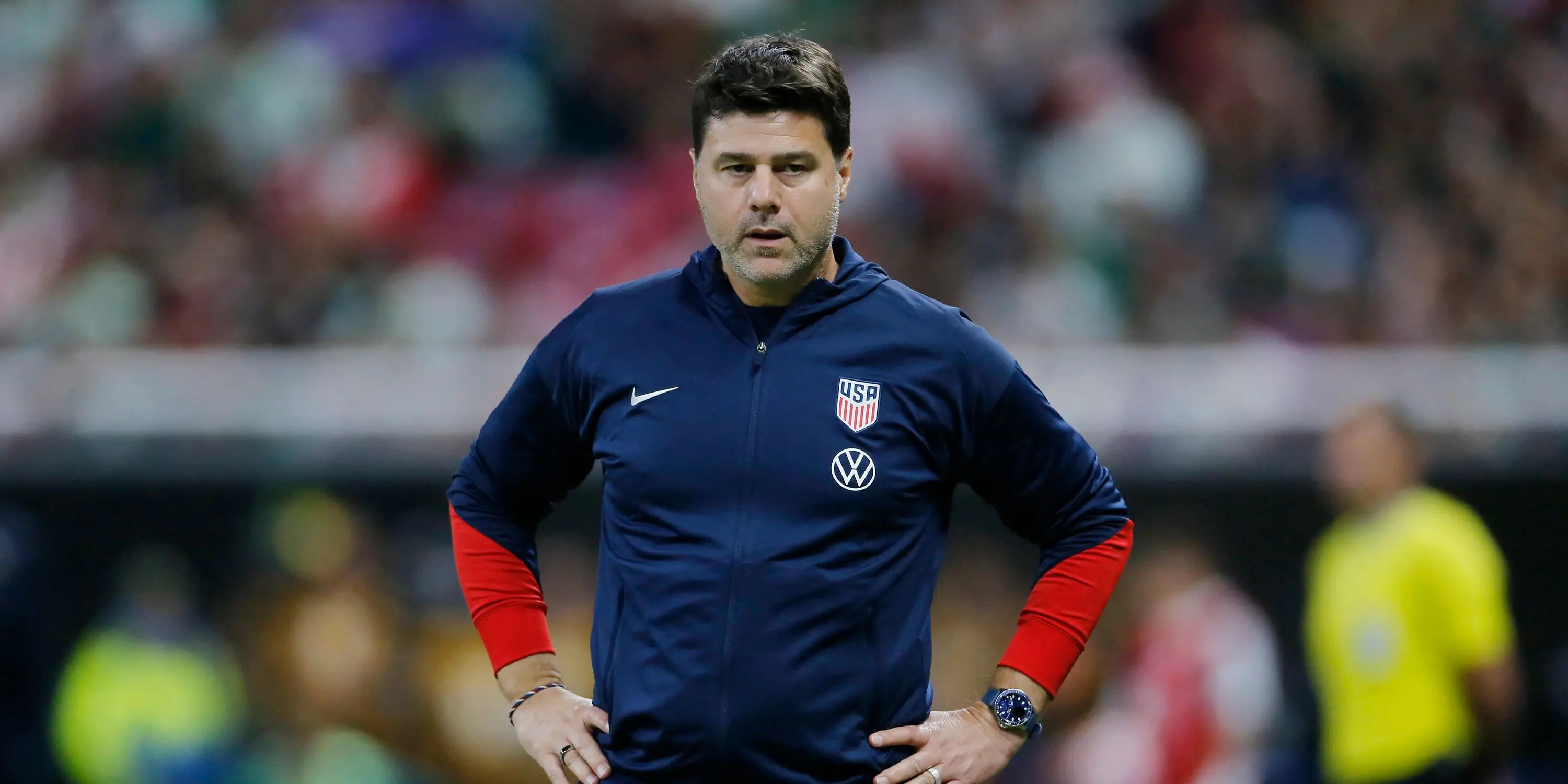 Mauricio Pochettino in a USA jacket during a soccer match.
