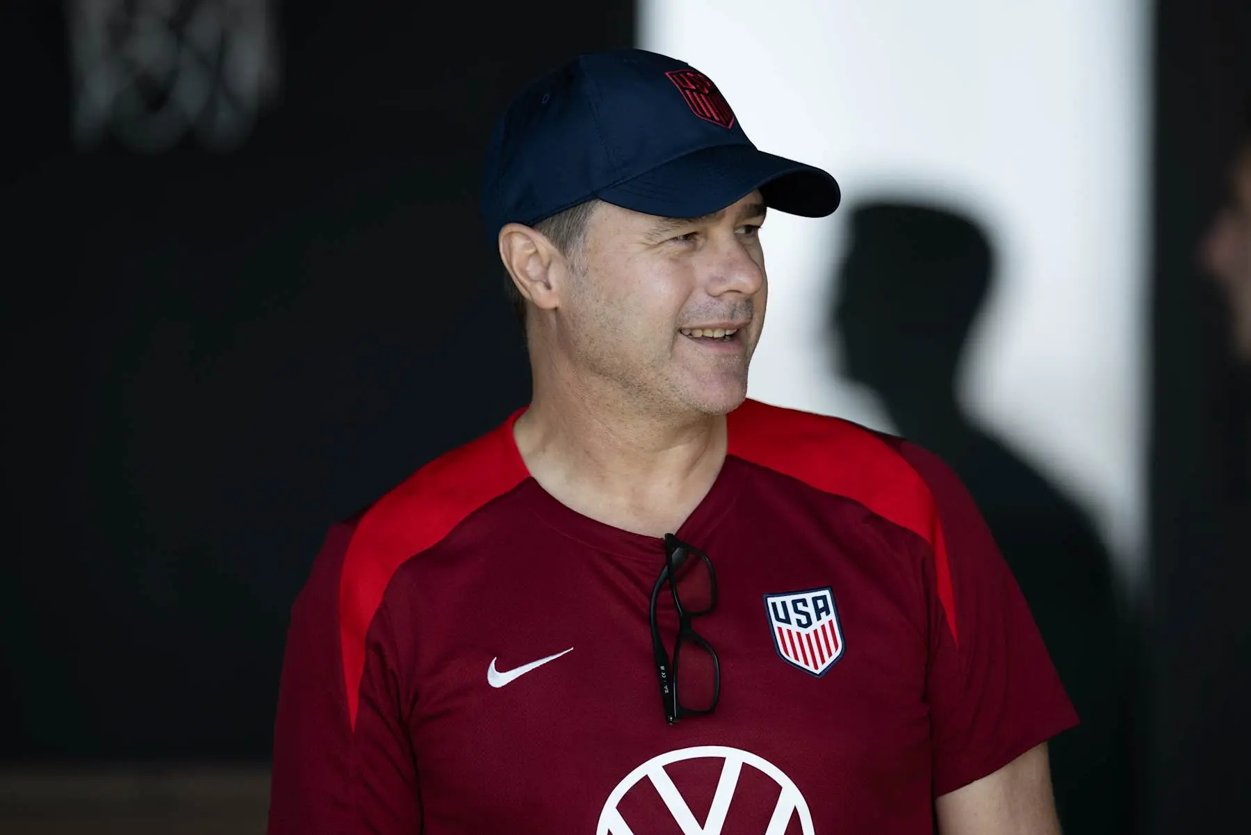 Mauricio Pochettino wearing a USA soccer jersey and cap.