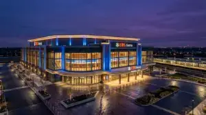 UBS Arena exterior illuminated at dusk in Elmont, New York