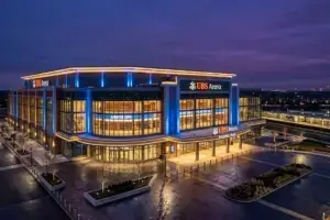 UBS Arena exterior illuminated at dusk in Elmont, New York