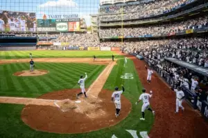 Yankees players celebrating on the basepaths during historic 13-run inning at Yankee Stadium