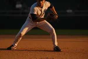 Yankees shortstop in fielding stance at Yankee Stadium infield during game
