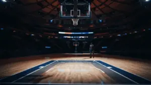 Empty basketball paint area under hoop showing defensive void in NBA arena lighting