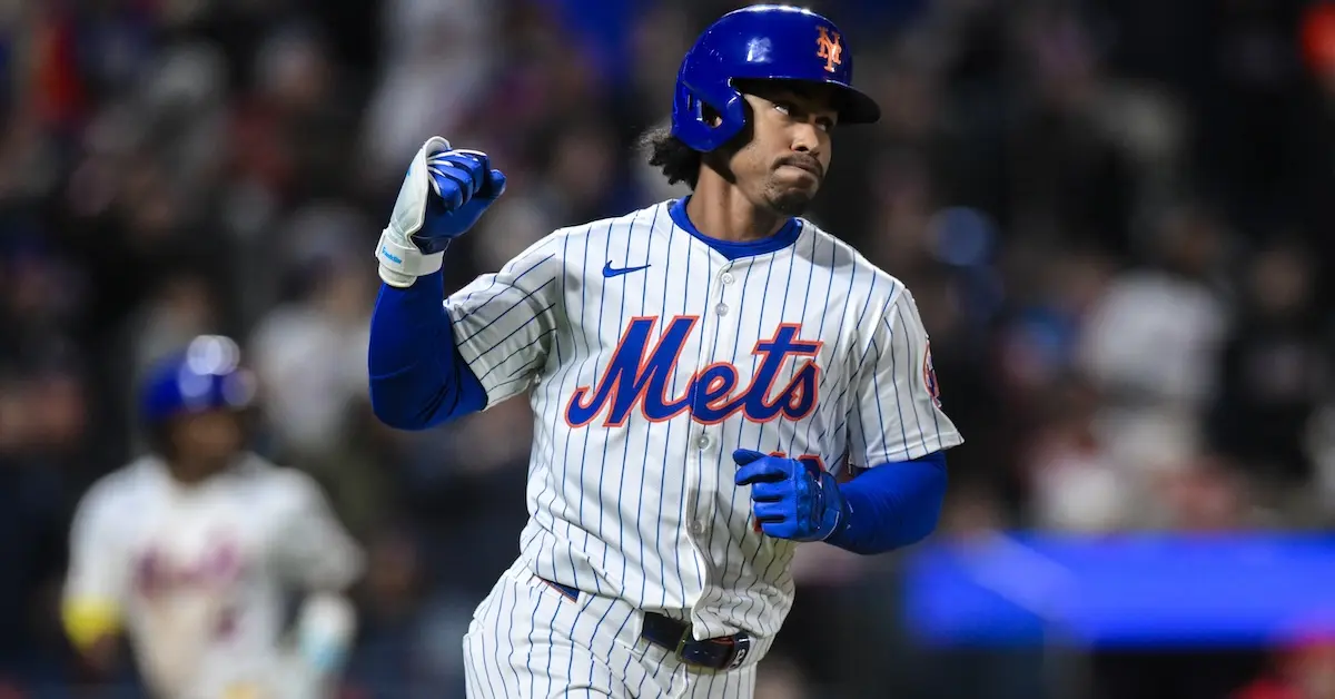 Francisco Lindor of the Mets celebrates after scoring during a game.