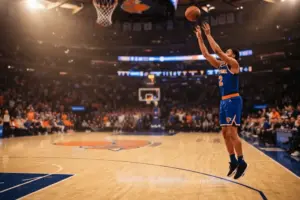 New York Knicks player shooting three-pointer at Madison Square Garden in dramatic arena lighting